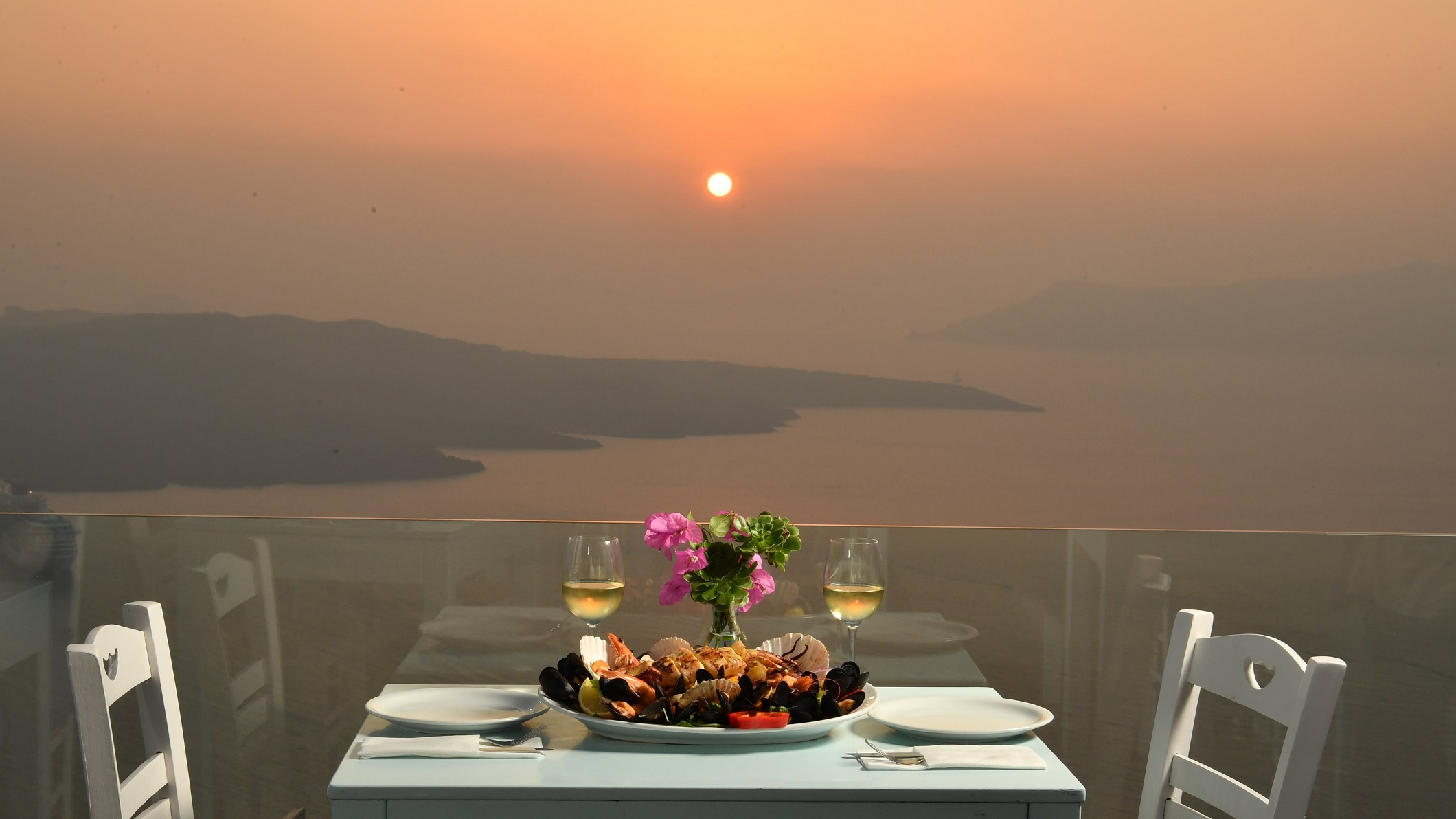 Volcano Blue Restaurant Santorini in Fira the view at Sunset Time